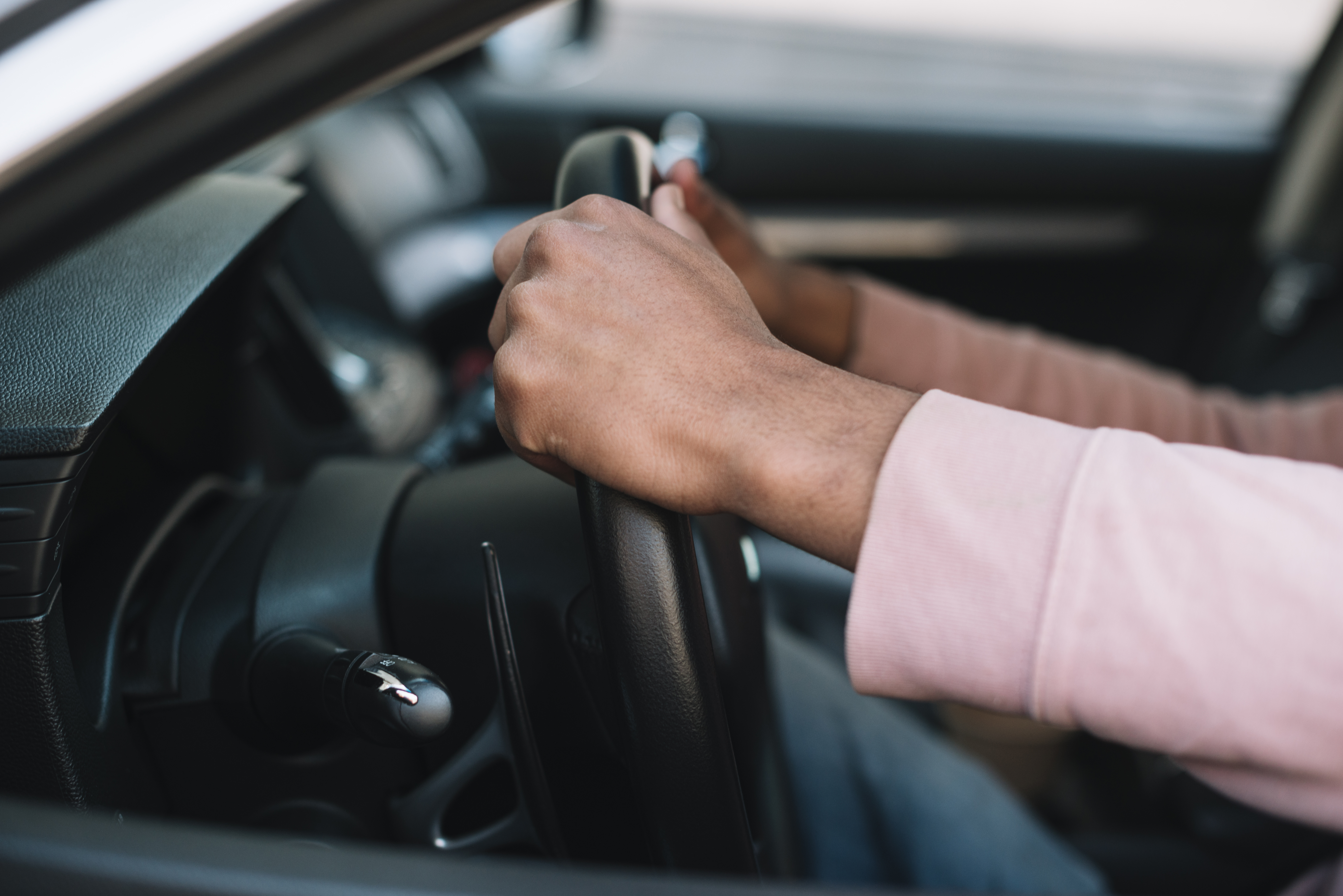 unrecognizable-man-driving-close-up
